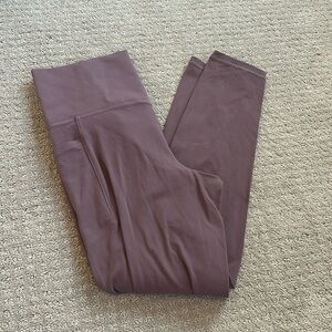 Athleta 7/8 salutation stash legging.